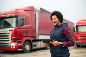 Fleet Manager standing in front of a truck
