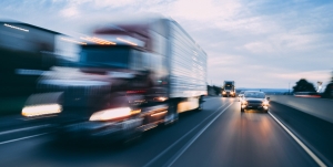 Image of a fast-moving semi truck
